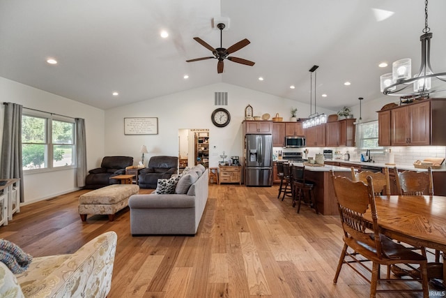 502 N Jefferson Ave, Fowler, IN 47944 - living area with light wood-style floors, lofted ceiling, healthy amount of natural light, ceiling fan, and recessed lighting
