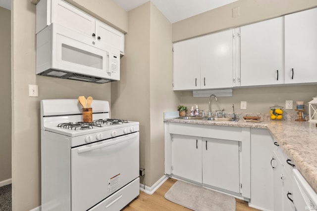 6031 S Calhoun St, Fort Wayne, IN 46803 - kitchen featuring white appliances, white cabinetry, and light wood-style floors