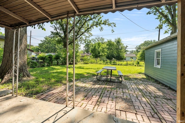 6031 S Calhoun St, Fort Wayne, IN 46803 - fenced backyard featuring a patio and outdoor dining space