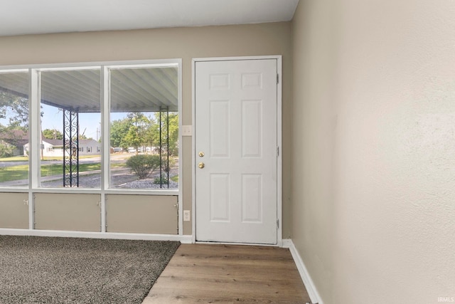 6031 S Calhoun St, Fort Wayne, IN 46803 - doorway to outside featuring wood finished floors and baseboards