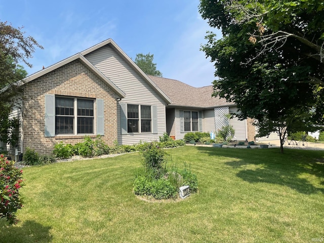 12344 Diamond Dr, Plymouth, IN 46563 - ranch-style house featuring brick siding and a front yard