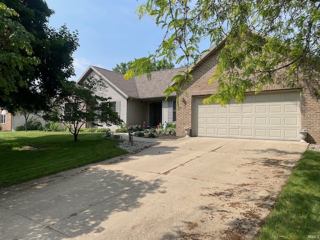 12344 Diamond Dr, Plymouth, IN 46563 - view of front of home with brick siding, a front yard, concrete driveway, and a garage