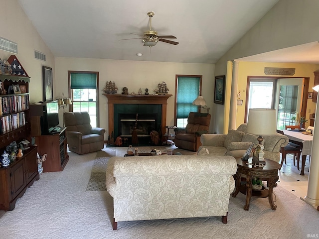 12344 Diamond Dr, Plymouth, IN 46563 - living room featuring vaulted ceiling, light colored carpet, plenty of natural light, a ceiling fan, and a fireplace