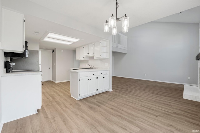 7104 Thamesford Dr Unit 83, Fort Wayne, IN 46835 - kitchen featuring light wood-style flooring, white cabinetry, light countertops, a chandelier, and open floor plan