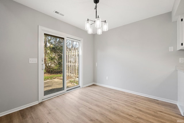 7104 Thamesford Dr Unit 83, Fort Wayne, IN 46835 - unfurnished dining area featuring light wood-type flooring and a chandelier