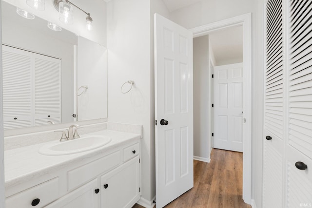 7104 Thamesford Dr Unit 83, Fort Wayne, IN 46835 - bathroom featuring a closet, vanity, and wood finished floors