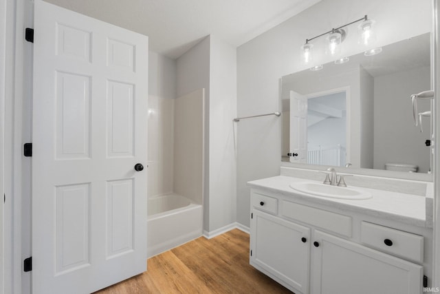 7104 Thamesford Dr Unit 83, Fort Wayne, IN 46835 - full bathroom featuring vanity, wood finished floors, and shower / washtub combination
