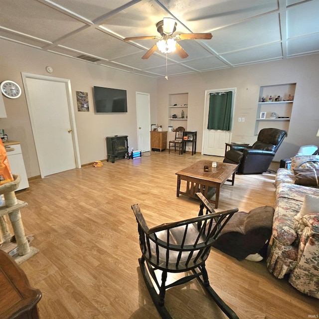 989 S Cataract Rd, Spencer, IN 47460 - living room featuring a ceiling fan, built in shelves, light wood finished floors, and coffered ceiling