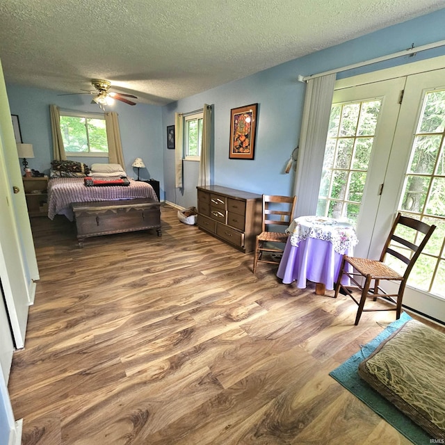 989 S Cataract Rd, Spencer, IN 47460 - bedroom featuring wood finished floors, a textured ceiling, and ceiling fan