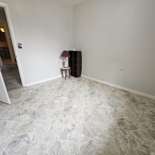 989 S Cataract Rd, Spencer, IN 47460 - empty room featuring stone finish flooring and baseboards