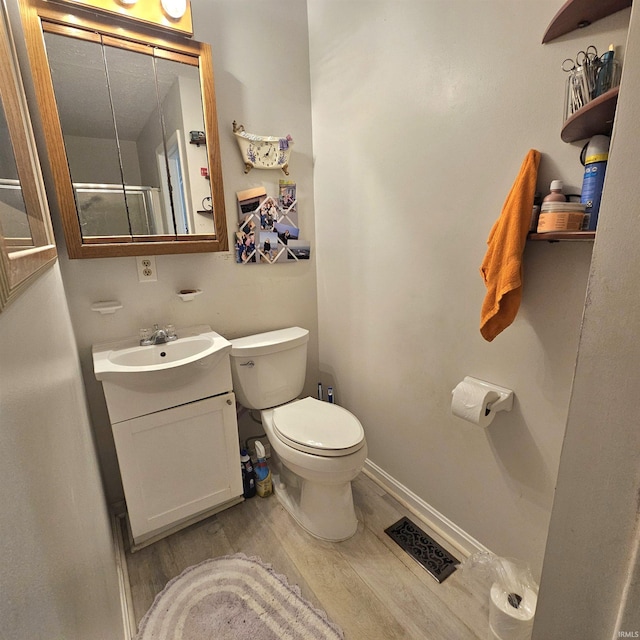 989 S Cataract Rd, Spencer, IN 47460 - bathroom featuring wood finished floors and vanity