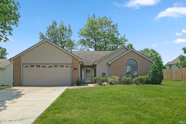 2319 Autumn Lake Pl, Fort Wayne, IN 46818 - single story home featuring brick siding, a garage, driveway, and a shingled roof