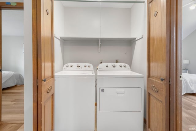 2319 Autumn Lake Pl, Fort Wayne, IN 46818 - laundry area with independent washer and dryer and light wood-style floors