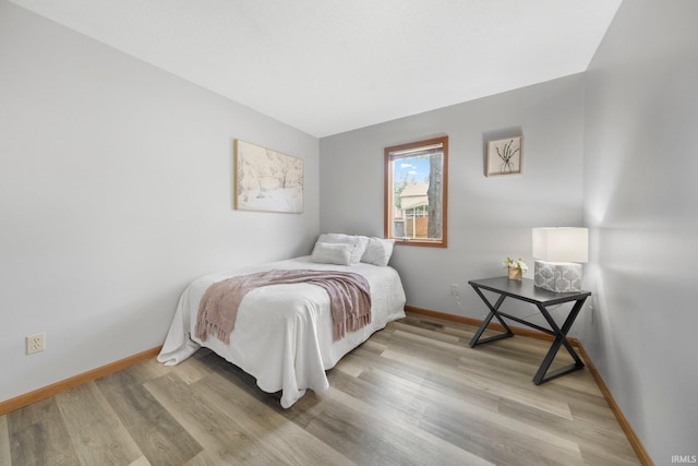 2319 Autumn Lake Pl, Fort Wayne, IN 46818 - bedroom with baseboards and light wood-type flooring