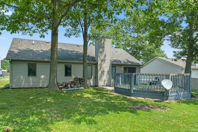 2319 Autumn Lake Pl, Fort Wayne, IN 46818 - back of house with a deck, a shingled roof, a lawn, and a chimney