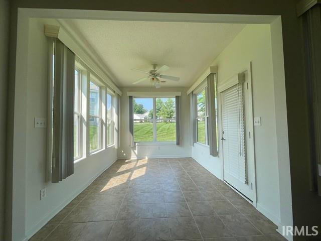 3239 S Parnel Ct, Bloomington, IN 47403 - unfurnished sunroom with baseboards and french doors