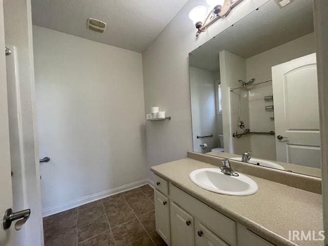 3239 S Parnel Ct, Bloomington, IN 47403 - full bath featuring vanity, a shower, and tile patterned floors