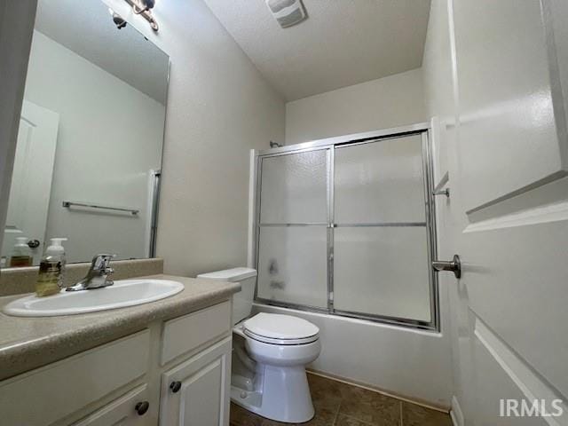 3239 S Parnel Ct, Bloomington, IN 47403 - full bathroom with vanity and bath / shower combo with glass door