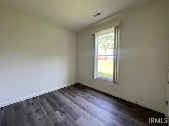 3239 S Parnel Ct, Bloomington, IN 47403 - empty room with dark wood-type flooring and baseboards