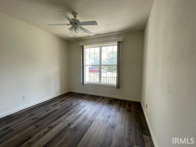 3239 S Parnel Ct, Bloomington, IN 47403 - unfurnished room with dark wood-style floors, a ceiling fan, and a textured ceiling