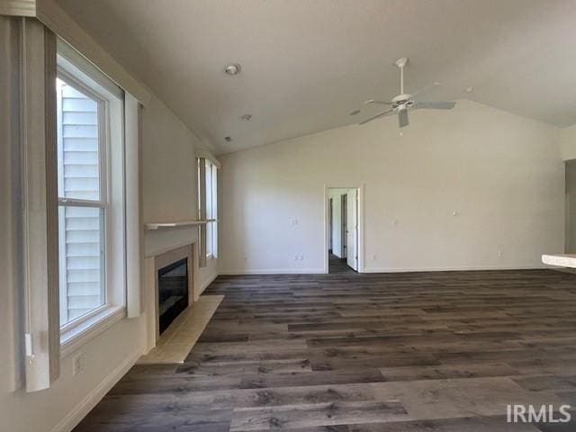3239 S Parnel Ct, Bloomington, IN 47403 - unfurnished living room with a fireplace with flush hearth, vaulted ceiling, dark wood-type flooring, and ceiling fan