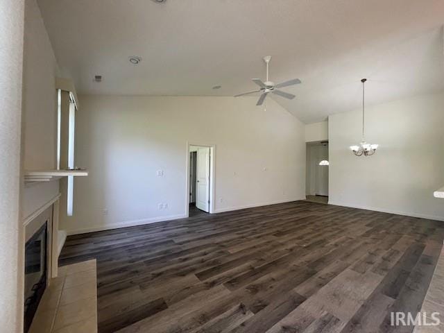 3239 S Parnel Ct, Bloomington, IN 47403 - unfurnished living room with a ceiling fan, a chandelier, a fireplace with flush hearth, dark wood-style floors, and high vaulted ceiling
