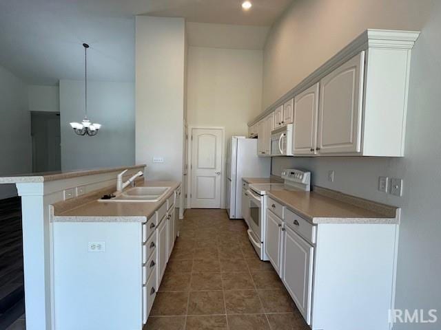 3239 S Parnel Ct, Bloomington, IN 47403 - kitchen with white appliances, a chandelier, light countertops, pendant lighting, and white cabinets