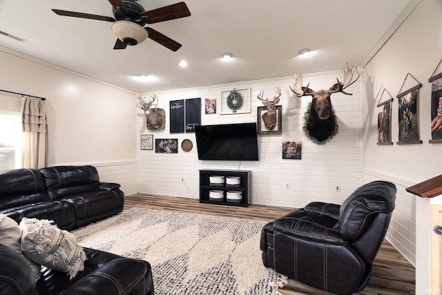 5157 N County Rd 850 W, Mulberry, IN 46058 - living room with crown molding, wood finished floors, ceiling fan, a wainscoted wall, and wooden walls