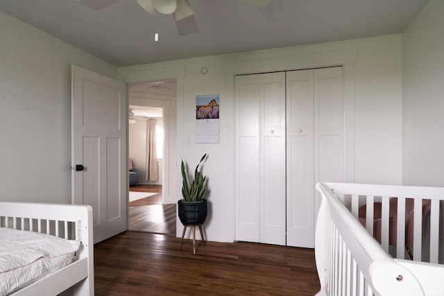 5157 N County Rd 850 W, Mulberry, IN 46058 - bedroom featuring dark wood-style floors, a closet, a ceiling fan, and a nursery area