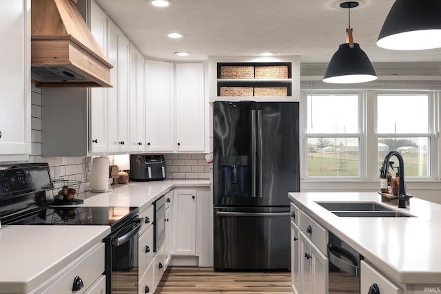 5157 N County Rd 850 W, Mulberry, IN 46058 - kitchen with black appliances, custom exhaust hood, light countertops, open shelves, and white cabinets