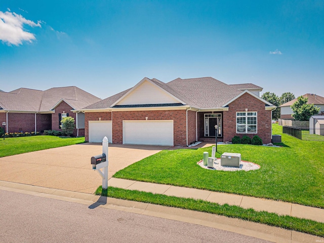 4261 Martha Ct, Newburgh, IN 47630 - view of front facade with an attached garage, driveway, brick siding, and a shingled roof