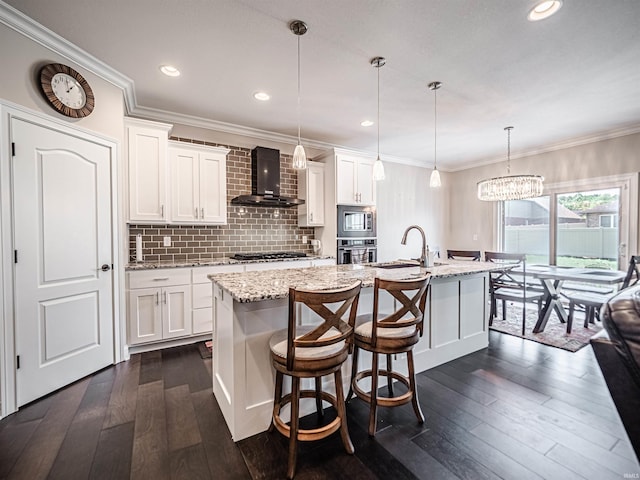 4261 Martha Ct, Newburgh, IN 47630 - kitchen with appliances with stainless steel finishes, wall chimney exhaust hood, dark wood-type flooring, an island with sink, and crown molding
