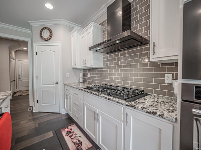 4261 Martha Ct, Newburgh, IN 47630 - kitchen featuring wall chimney exhaust hood, black gas cooktop, ornamental molding, white cabinetry, and freestanding refrigerator