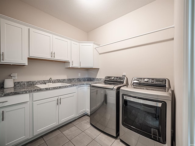 4261 Martha Ct, Newburgh, IN 47630 - laundry room featuring washing machine and dryer, cabinet space, and light tile patterned floors
