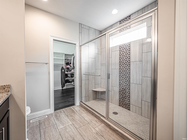 4261 Martha Ct, Newburgh, IN 47630 - bathroom featuring a shower stall, vanity, a spacious closet, and recessed lighting