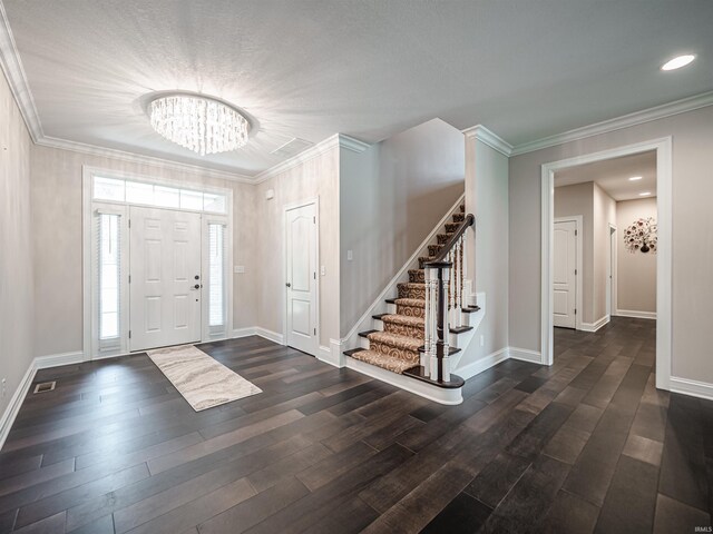 4261 Martha Ct, Newburgh, IN 47630 - foyer with a chandelier, stairway, dark wood finished floors, and crown molding