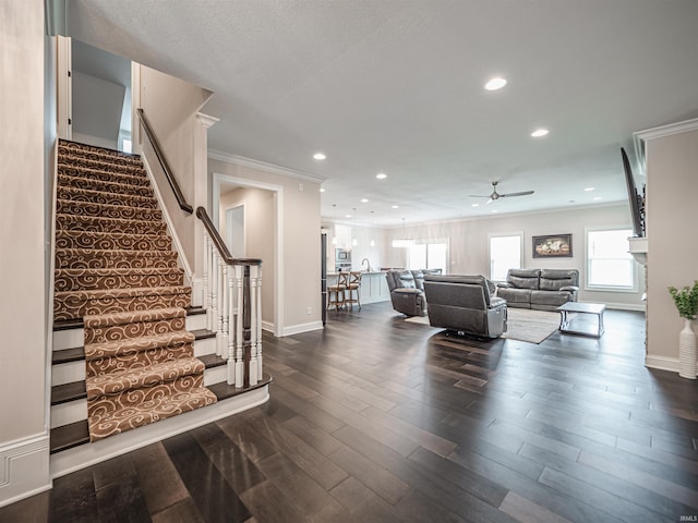 4261 Martha Ct, Newburgh, IN 47630 - living room featuring a ceiling fan, ornamental molding, stairway, recessed lighting, and dark wood-style flooring