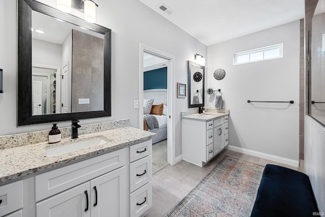 4831 Leeward Ln, Lafayette, IN 47909 - full bathroom with two vanities, connected bathroom, and a shower