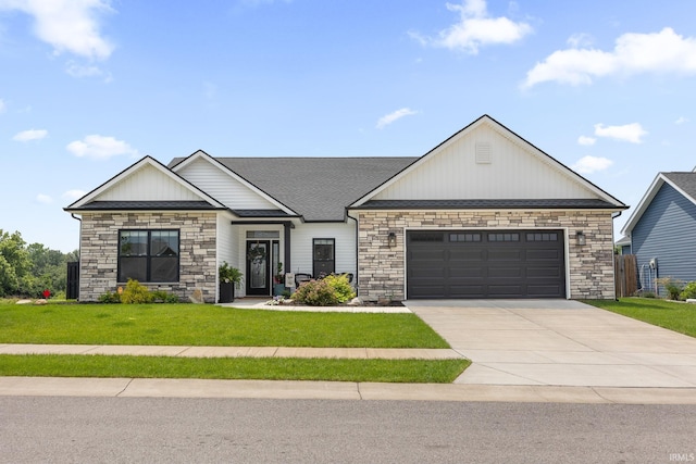 4831 Leeward Ln, Lafayette, IN 47909 - view of front of house featuring stone siding, concrete driveway, a garage, a front lawn, and a shingled roof