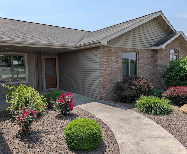 1260 Carrington Way, Berne, IN 46711 - property entrance with brick siding and roof with shingles
