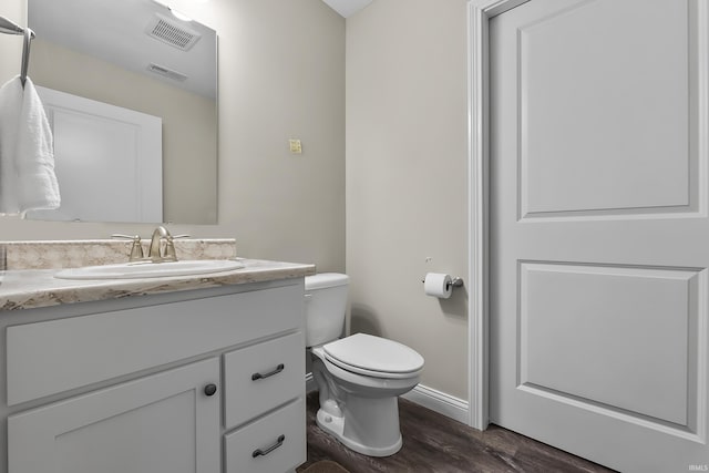 773 Sycamore St, Decatur, IN 46733 - half bathroom featuring vanity and wood finished floors