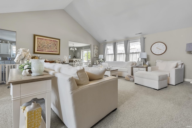 773 Sycamore St, Decatur, IN 46733 - living room featuring light colored carpet, high vaulted ceiling, and a chandelier