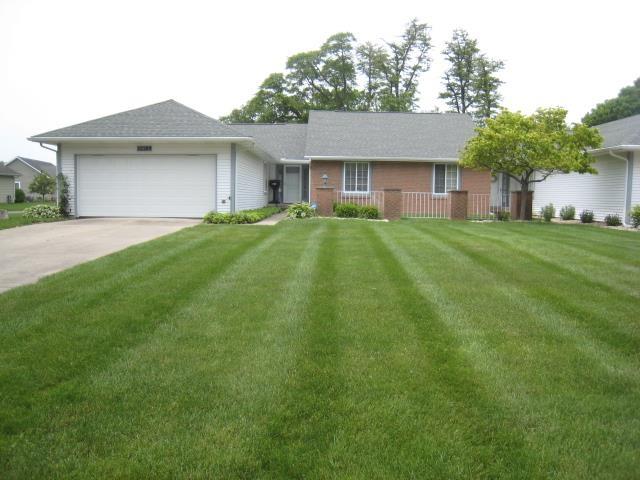 52289 Wembley Dr, South Bend, IN 46637 - ranch-style house with an attached garage, driveway, and a front yard