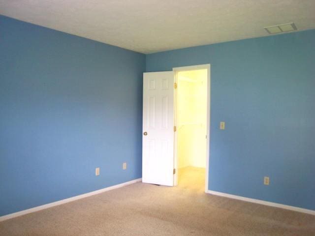 52289 Wembley Dr, South Bend, IN 46637 - spare room featuring carpet flooring and baseboards