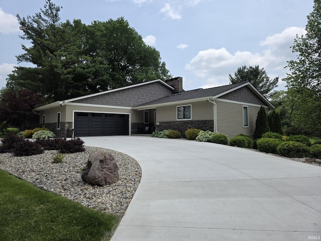 1051 Morningstar Rd, Auburn, IN 46706 - ranch-style house featuring an attached garage, stone siding, and concrete driveway