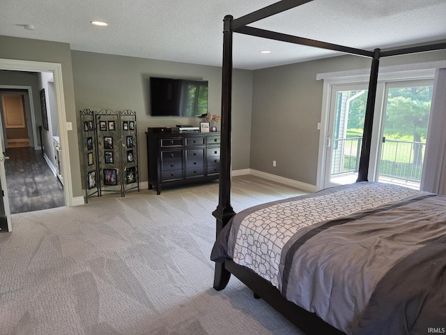 1051 Morningstar Rd, Auburn, IN 46706 - bedroom with access to outside, light colored carpet, a textured ceiling, and recessed lighting