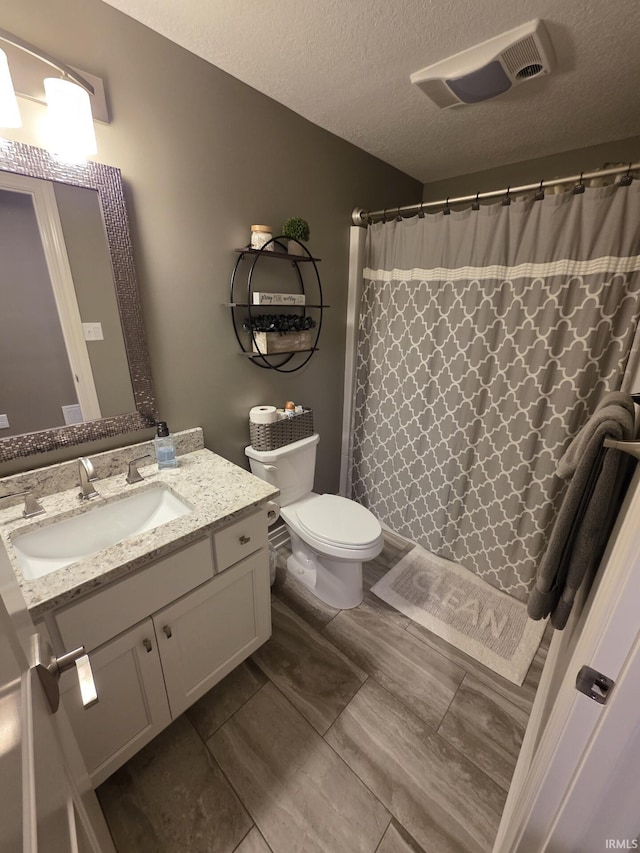 1051 Morningstar Rd, Auburn, IN 46706 - bathroom featuring vanity, a textured ceiling, and a shower with curtain