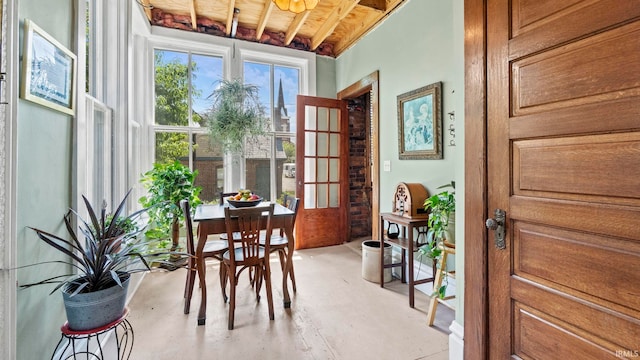 721 W Wayne St, Fort Wayne, IN 46802 - dining space with concrete flooring and wood ceiling