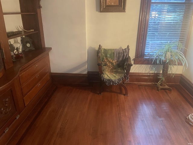 721 W Wayne St, Fort Wayne, IN 46802 - living area with dark wood-style flooring and baseboards