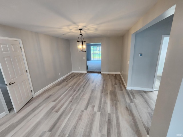 1584 Snyder St, Wabash, IN 46992 - unfurnished dining area with light wood-style flooring and a chandelier